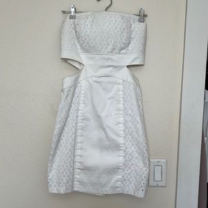 White strapless mini dress with side cutouts. Size 5/6.
